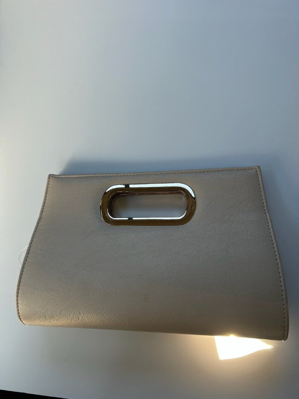Ruby & Kit Champagne Clutch with Cut-Out Handle